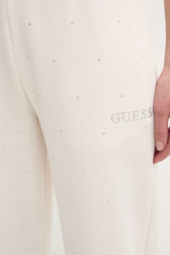 Спортивні штани Guess RHINESTONES бежевий V5RB08.KCLJ0
