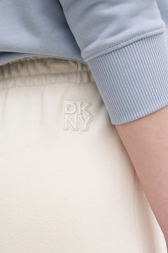 Dkny spodnie dresowe bawełniane beżowy DJ5P3068