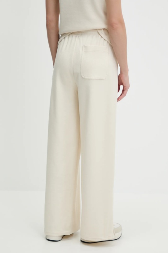 Odzież Puma spodnie dresowe 685061 beżowy