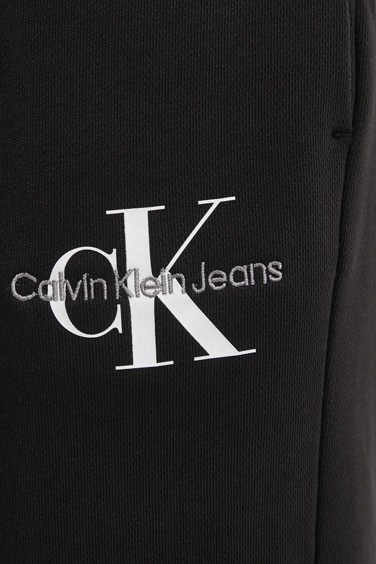 Bavlněné tepláky Calvin Klein Jeans černá J20J225354