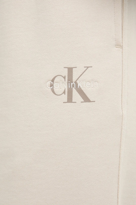Tepláky Calvin Klein Jeans béžová LV047B235G