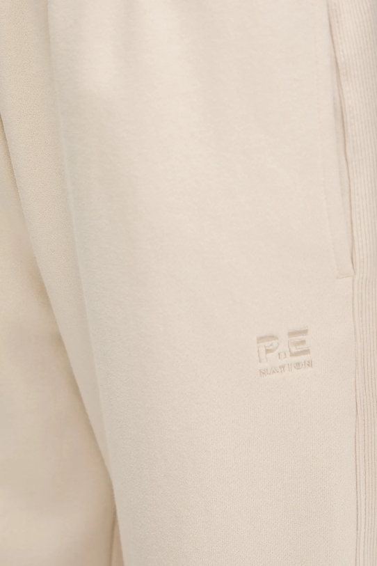 P.E Nation spodnie dresowe bawełniane Adventure beżowy 243P408