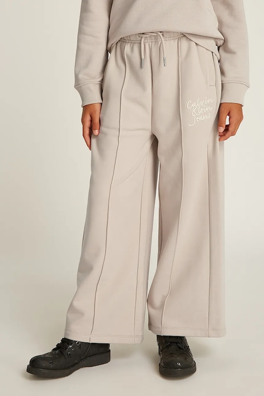 Calvin Klein Jeans spodnie dresowe dziecięce HANDW LOGO WIDE dzianina beżowy IG0IG02775.116.PPYA