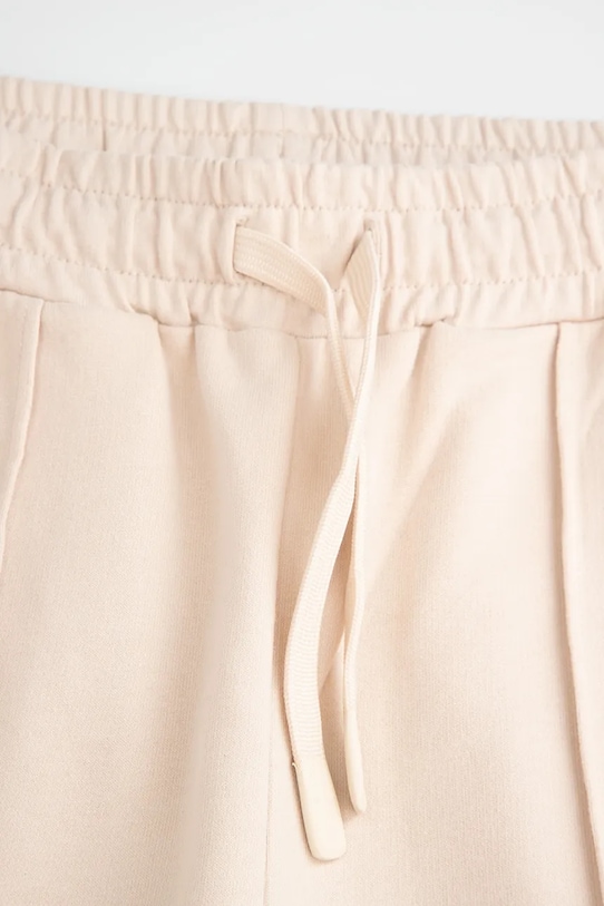 Dziewczynka Coccodrillo spodnie dresowe dziecięce WC5120101VGA beżowy