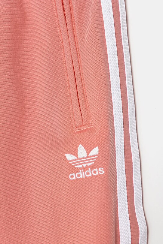 Otroški spodnji del trenirke adidas Originals roza JD1634