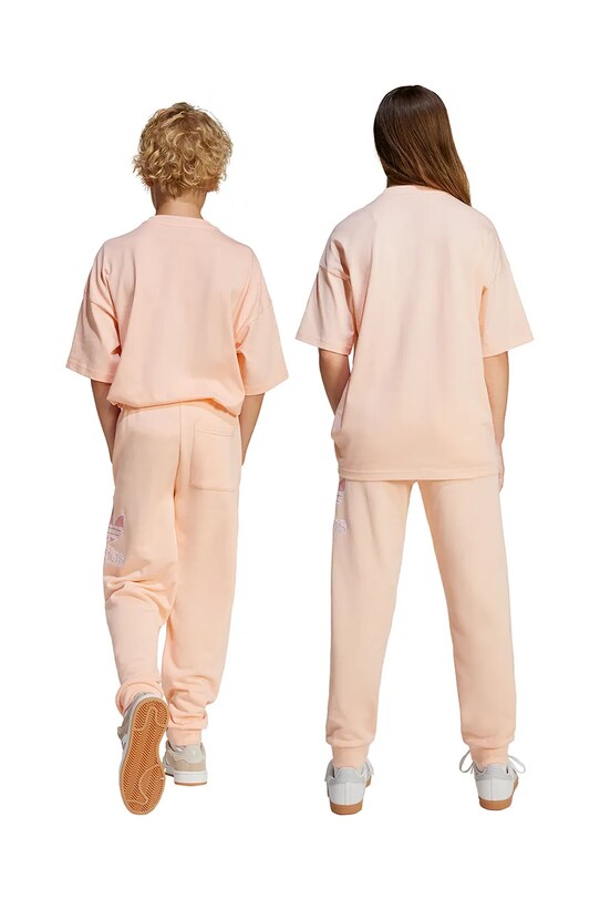 adidas Originals spodnie dresowe bawełniane dziecięce JC9143 pomarańczowy