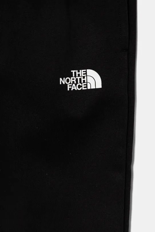 Chłopiec The North Face spodnie dresowe dziecięce TEEN REGULAR TAPERED JOGGERS NF0A8BHTJK31 czarny