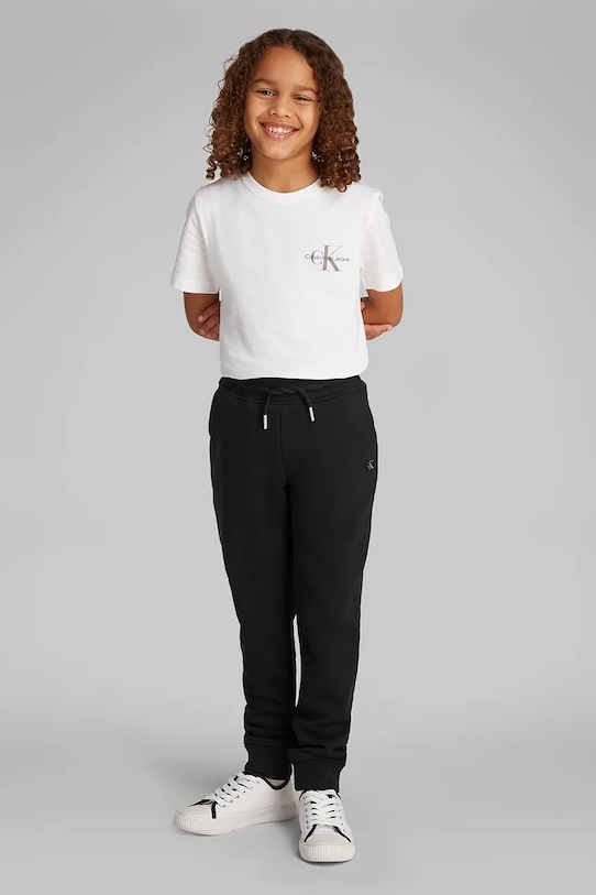 Dječji donji dio trenirke Calvin Klein Jeans bez uzorka crna IU0IU00621.PPYA