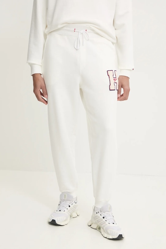 Tommy Jeans spodnie dresowe bawełniane aplikacja beżowy DM0DM21277