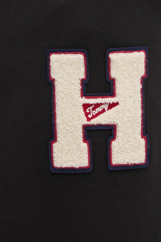 Bavlněné tepláky Tommy Jeans černá DM0DM21277