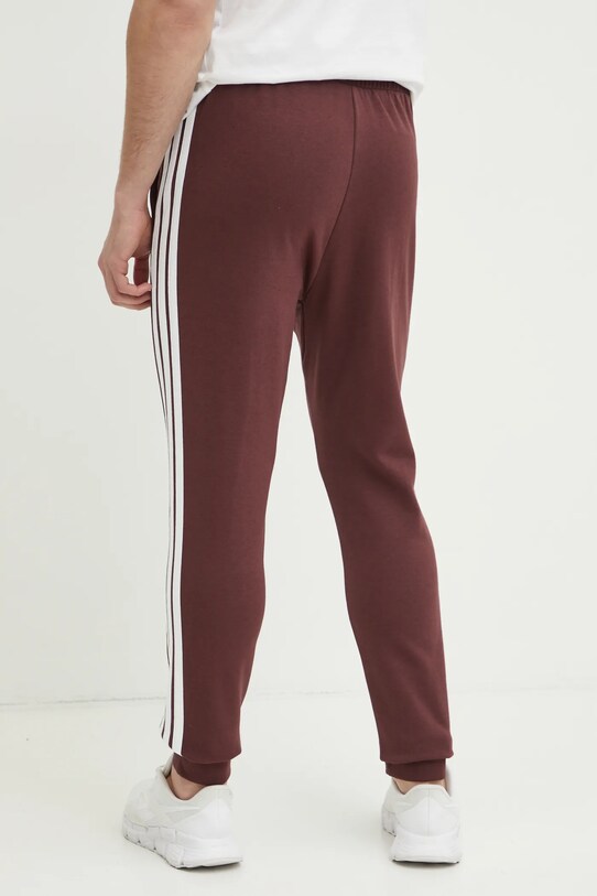 Дрехи Спортен панталон adidas Essentials JD1853 бордо