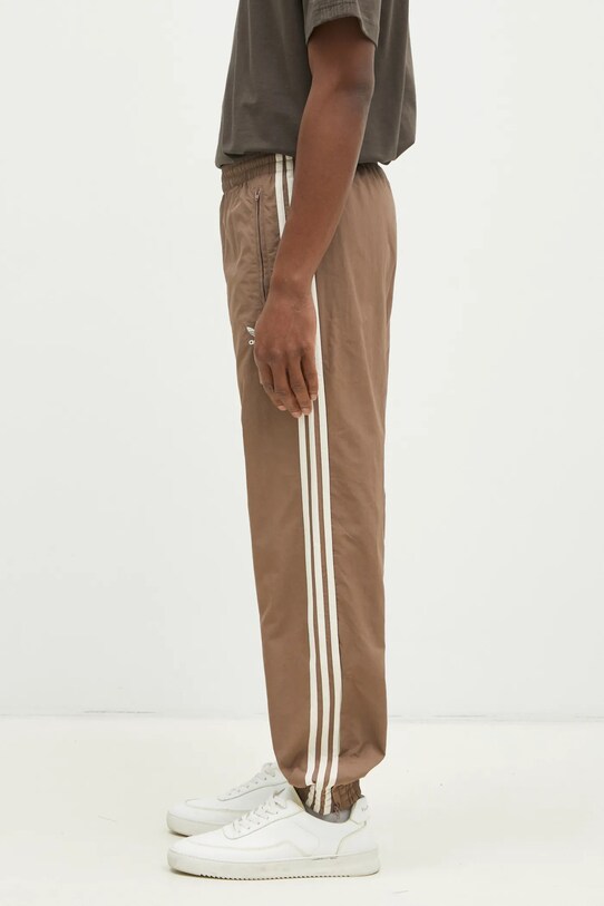 Donji dio trenirke adidas Originals Firebird JP1024 bež SS25