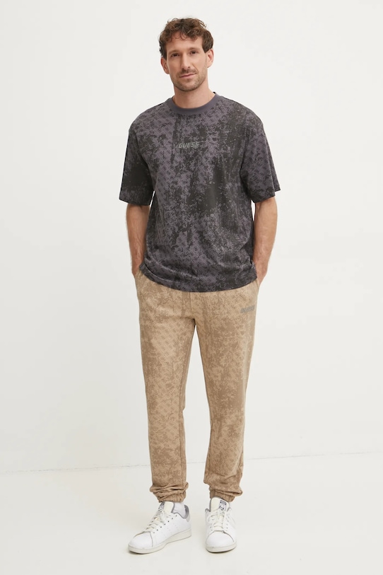 Guess spodnie dresowe bawełniane GOTAM Z5RB14.K9YI1 beżowy SS25