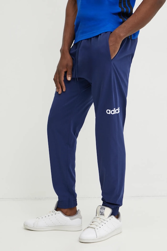 Tepláky adidas Essentials Linear tmavomodrá JE9011