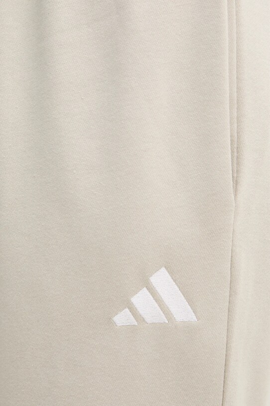 adidas pantaloni della tuta Feelcozy beige IN6078