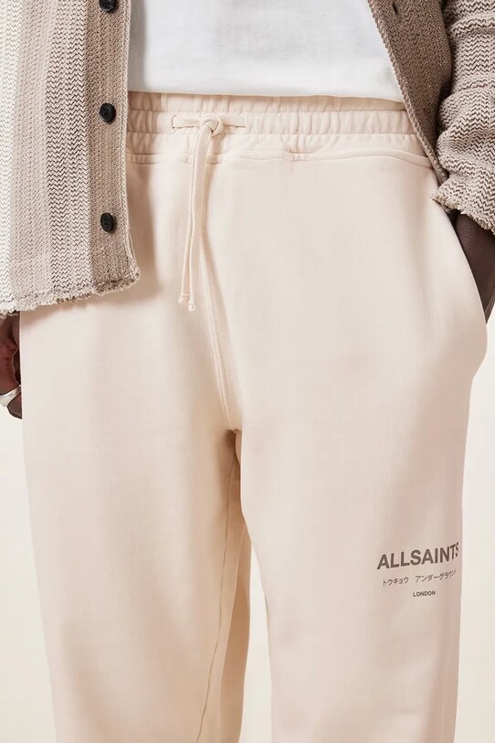 Odzież AllSaints spodnie dresowe bawełniane UNDRGRND M031TB beżowy
