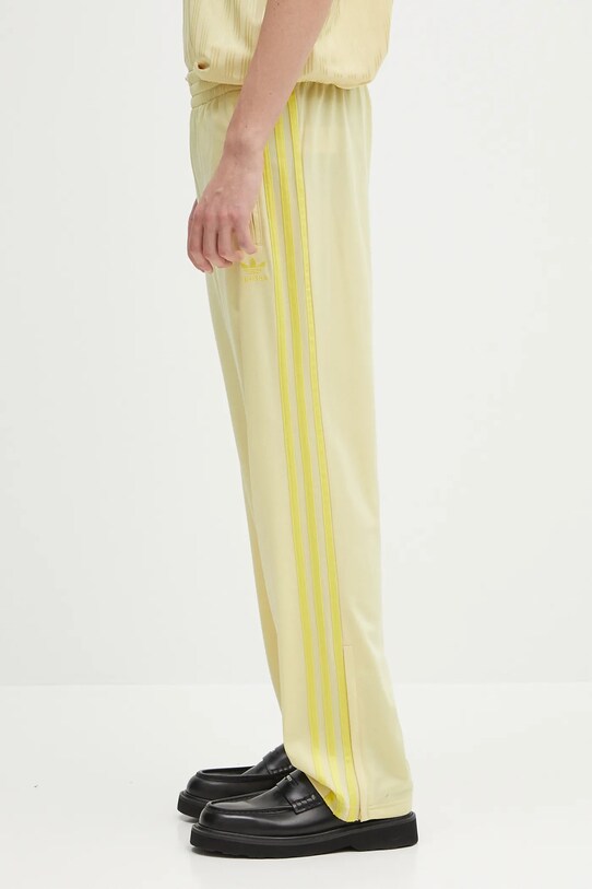 Donji dio trenirke adidas Originals Firebird JP2537 zlatna SS25