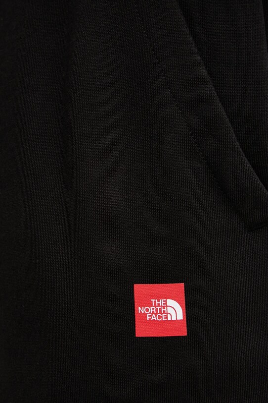 Bavlněné tepláky The North Face Axys černá NF0A8C1UJK31