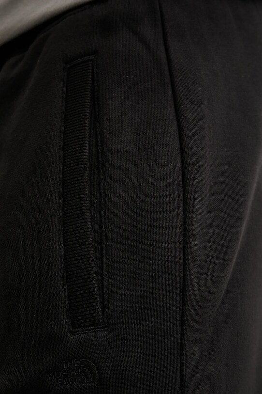 The North Face pamut melegítőnadrág Dome Relaxed fekete NF0A8C3SJK31