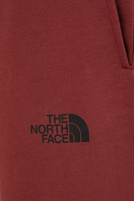 The North Face spodnie dresowe TNF X NSE bordowy NF0A8C3W0VO1