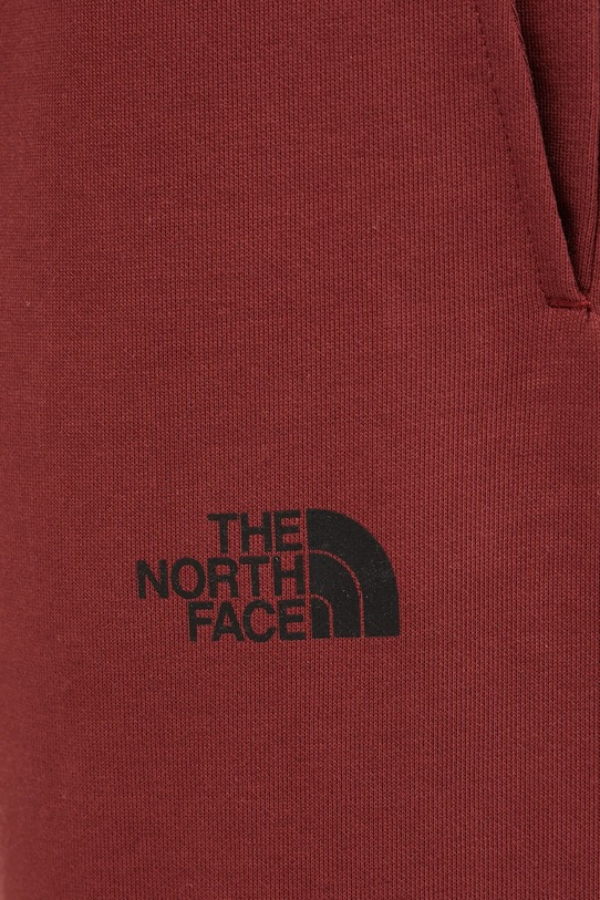 The North Face spodnie dresowe TNF X NSE bordowy NF0A8C3W0VO1