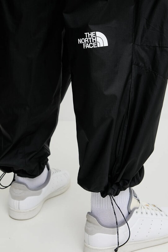 The North Face spodnie TNF X NSE czarny NF0A8BJQJK31