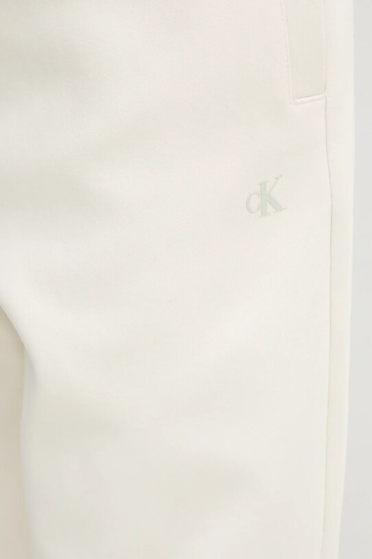 Tepláky Calvin Klein Jeans béžová J30J327241