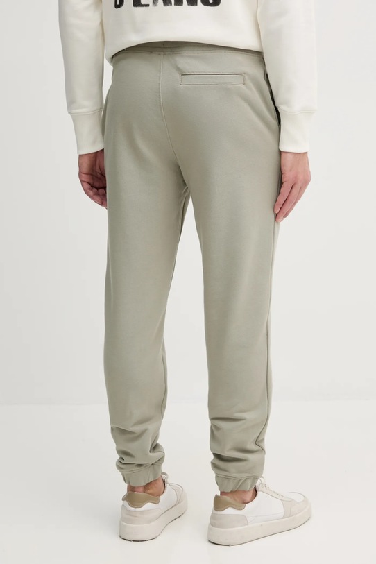 Odzież Calvin Klein Jeans spodnie dresowe bawełniane J30J327535 zielony