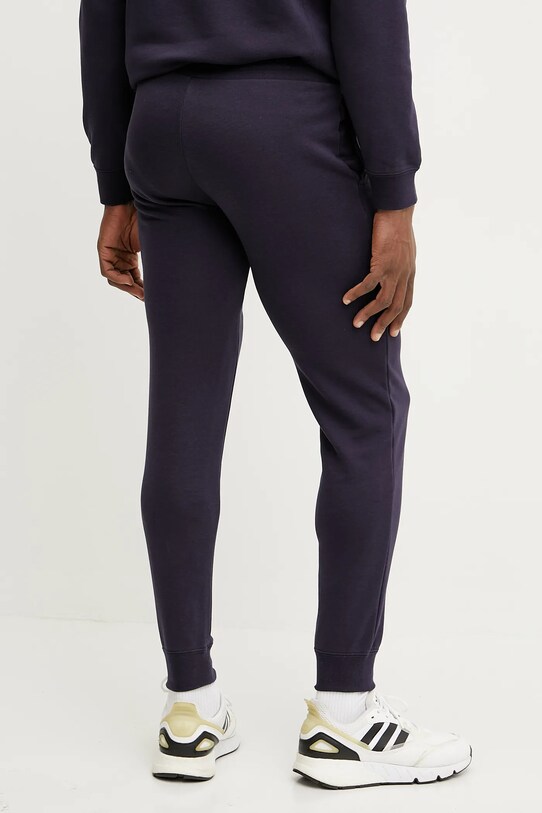 Odzież Puma spodnie dresowe 684652 granatowy