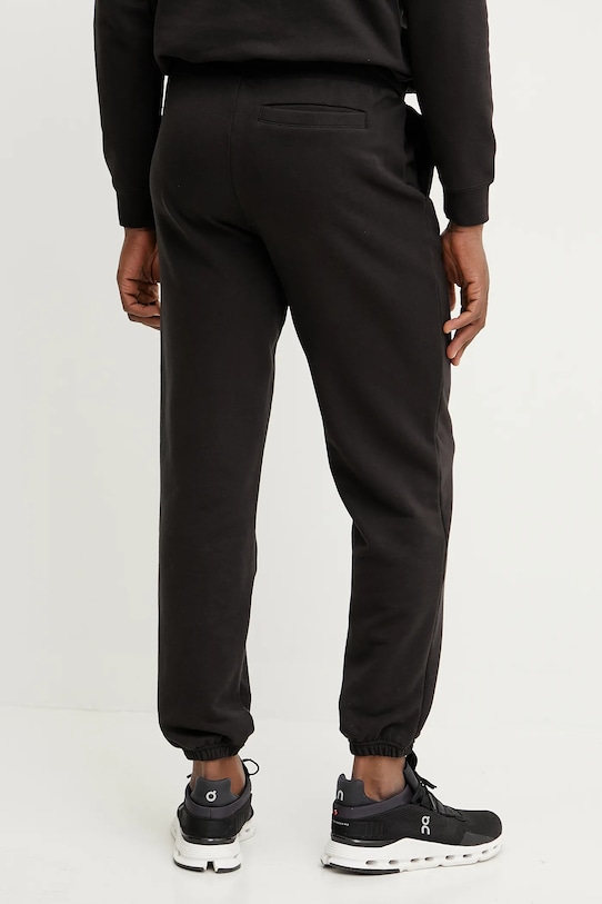 Odzież Puma spodnie dresowe bawełniane 631535 czarny