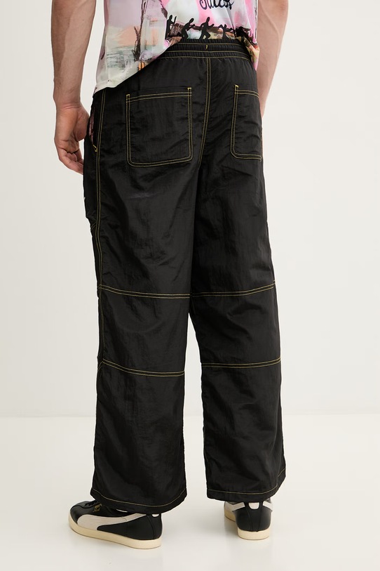 Odzież Puma spodnie dresowe PUMA x KIDSUPER Pants 629515 czarny