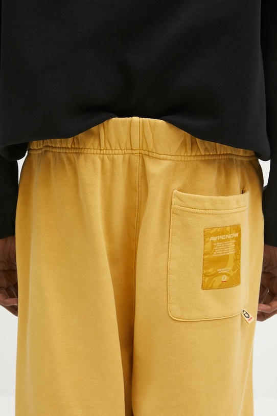 Pamučni donji dio trenirke AAPE Now Sweat zlatna AAPPTMB627XXN