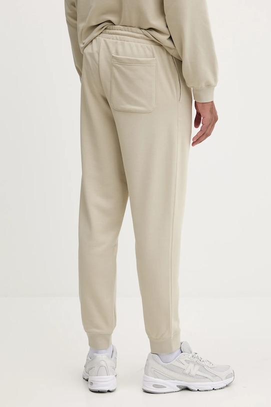 Converse spodnie dresowe 10026982.A09 beżowy
