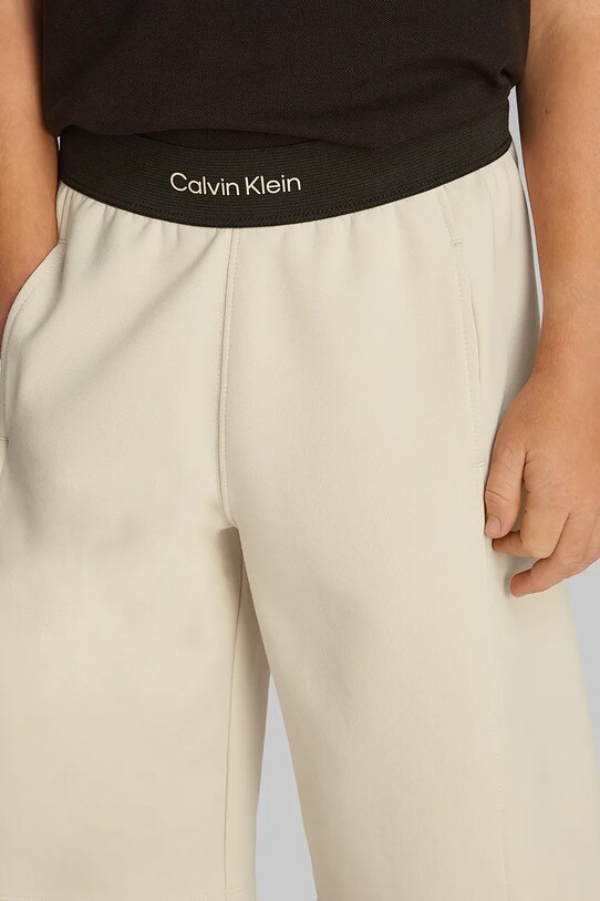 Дитячі шорти Calvin Klein Jeans IB0IB02436.PPYA бежевий