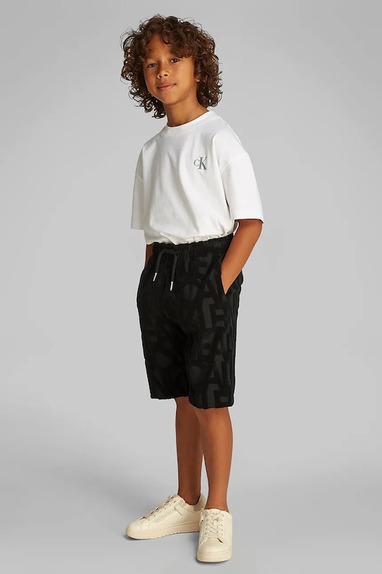 Дитячі шорти Calvin Klein Jeans дрібний узор чорний IB0IB02426.PPYA
