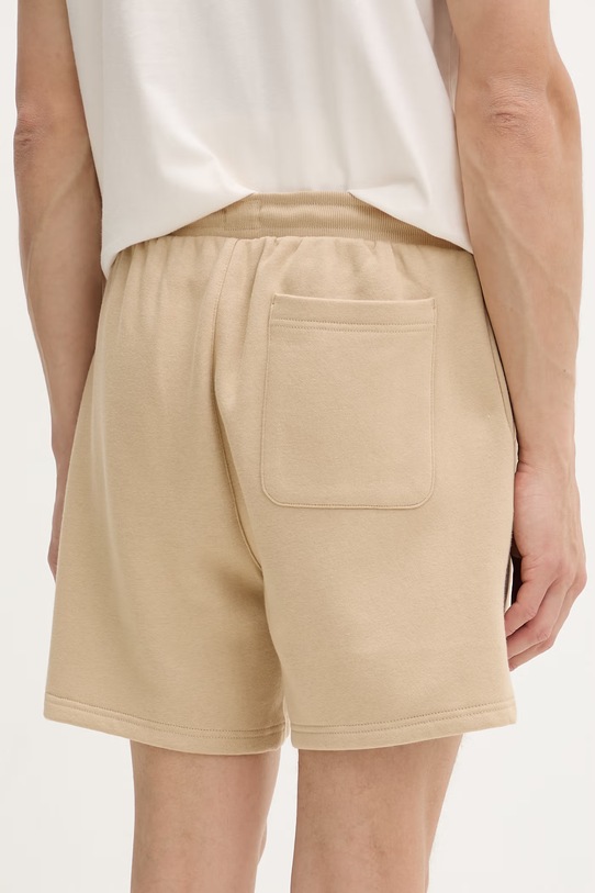 Odzież Tommy Jeans szorty dresowe męskie z bawełną DM0DM21931 beżowy