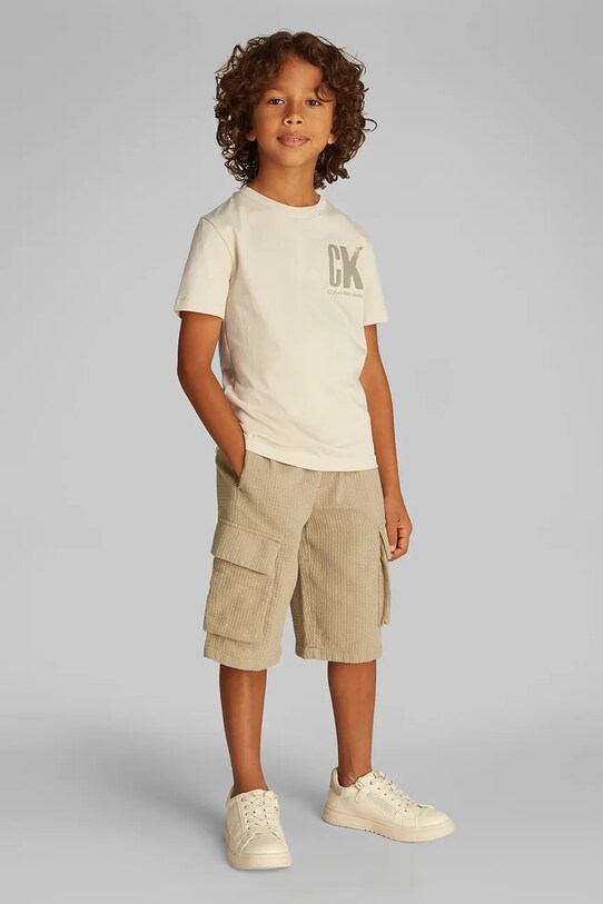 Детская хлопковая футболка Calvin Klein Jeans хлопок бежевый IB0IB02447.128.176.PPYA