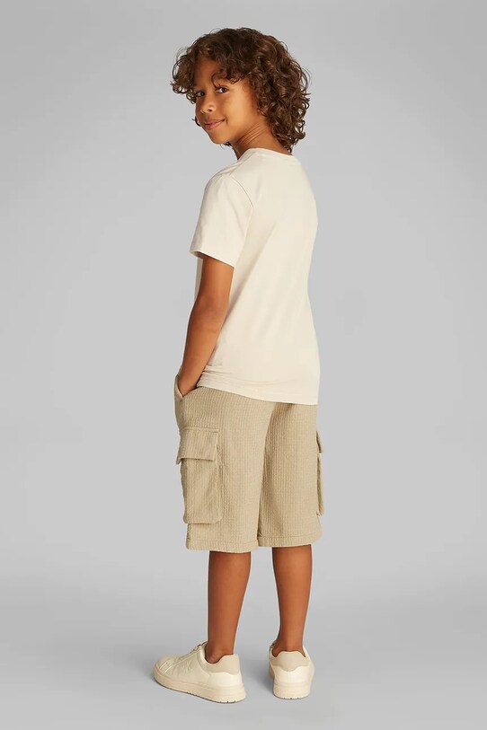 Детская хлопковая футболка Calvin Klein Jeans бежевый IB0IB02447.128.176.PPYA