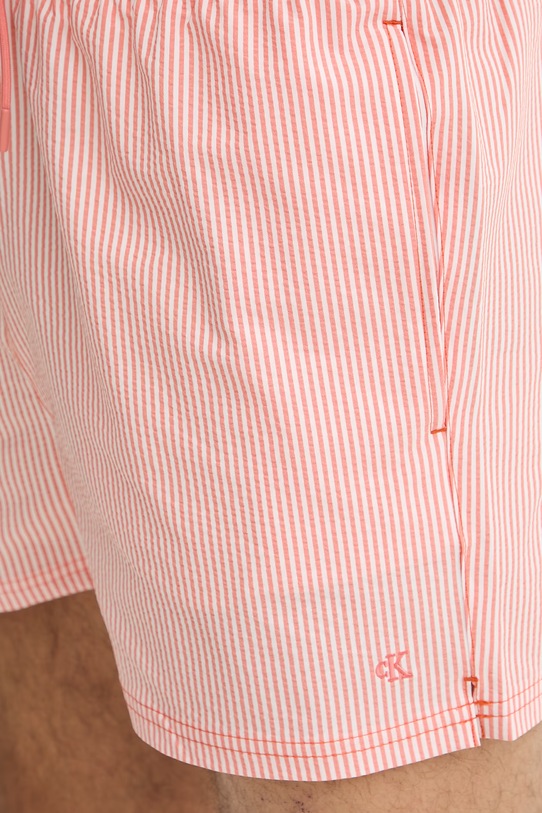 Calvin Klein plavecké šortky pánske oranžová LV00N61041