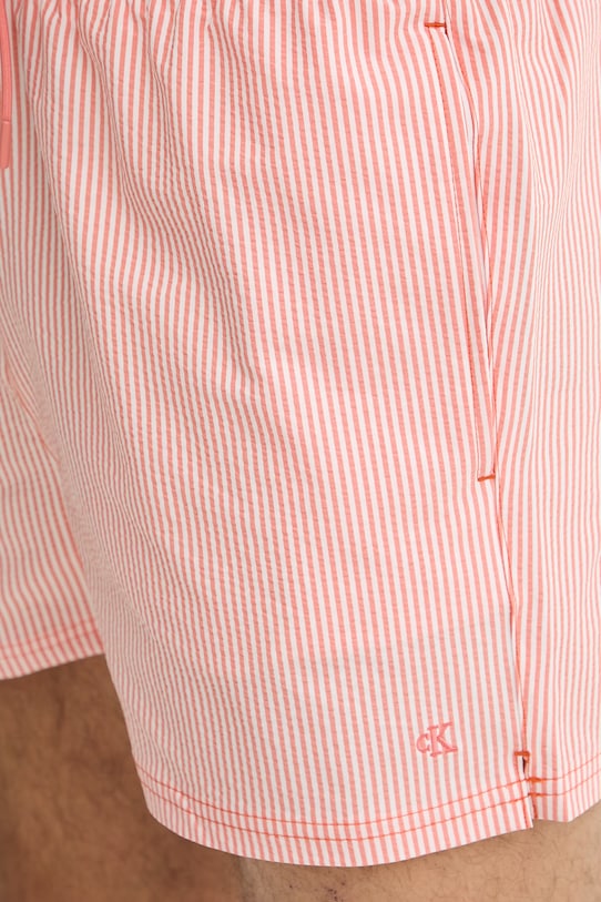 Calvin Klein plavecké šortky pánske oranžová LV00N61041