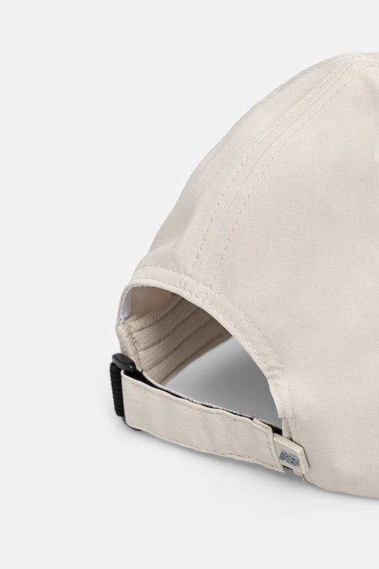 Akcesoria New Balance czapka z daszkiem LAH51002SHY beżowy