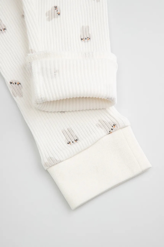 Coccodrillo legginsy dziecięce bawełniane beżowy WC6122103HUN