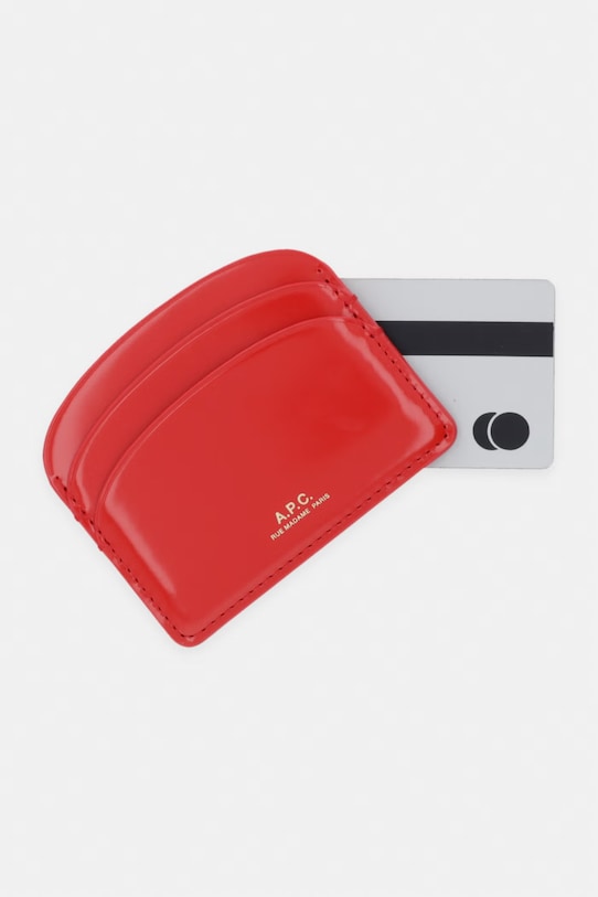Akcesoria A.P.C. etui na karty damskie skórzane PORTE-CARTES DEMI-LUNE PXCBT.F63270 czerwony