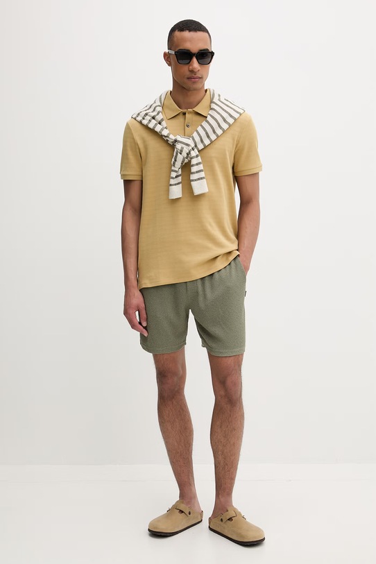 Calvin Klein polo męskie z bawełny LV04LF206G żółty SS26