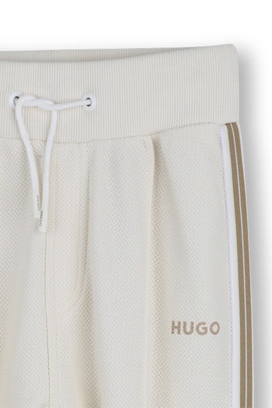 Chłopiec HUGO spodnie dresowe dziecięce bawełniane G00981.114.150 beżowy