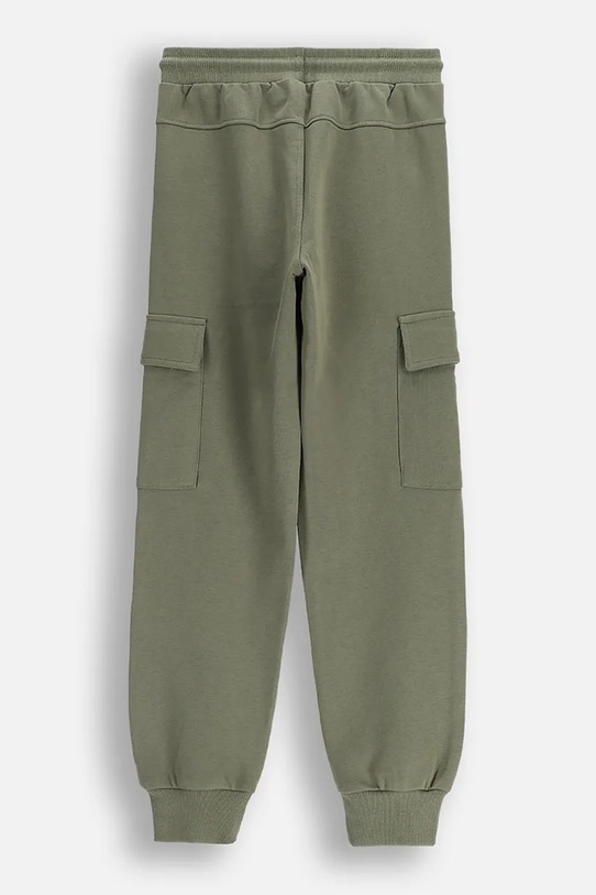 Детски памучен панталон Coccodrillo WC6120103VBA тюркоазен SS26