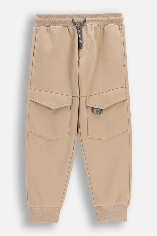 Coccodrillo spodnie dresowe dziecięce z bawełną beżowy WC6120103NBK