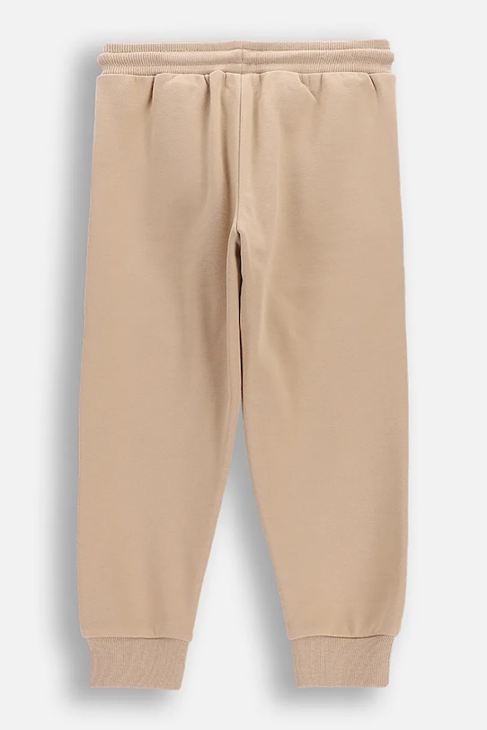 Coccodrillo spodnie dresowe dziecięce z bawełną WC6120103NBK beżowy SS26