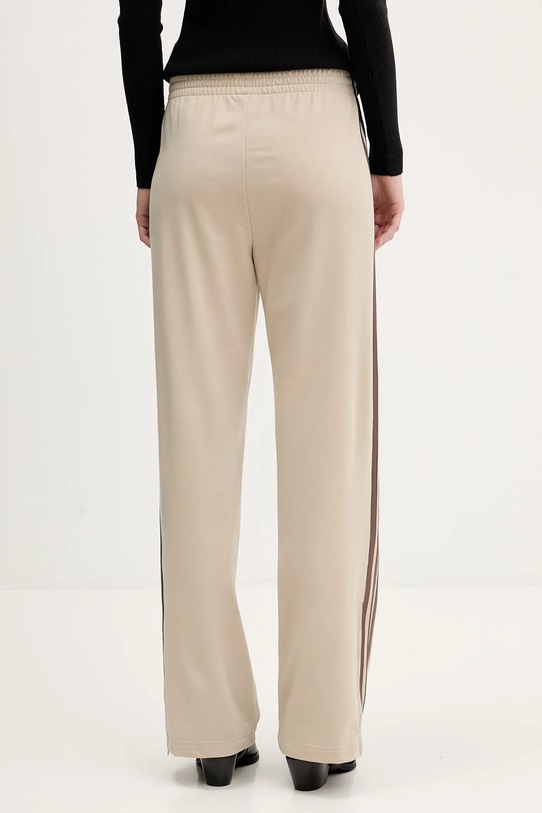 Odzież adidas Originals spodnie dresowe Firebird KD3660 beżowy