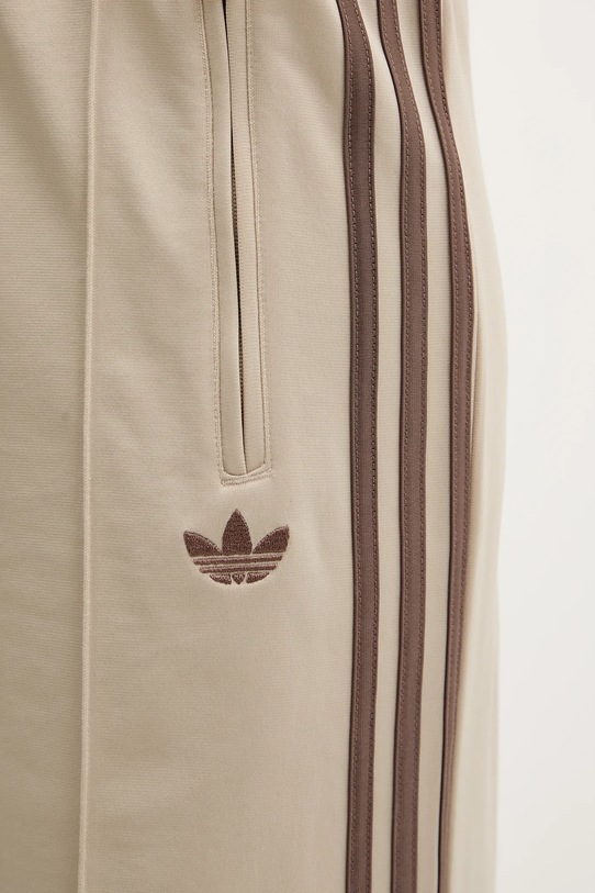 adidas Originals spodnie dresowe Firebird beżowy KD3660